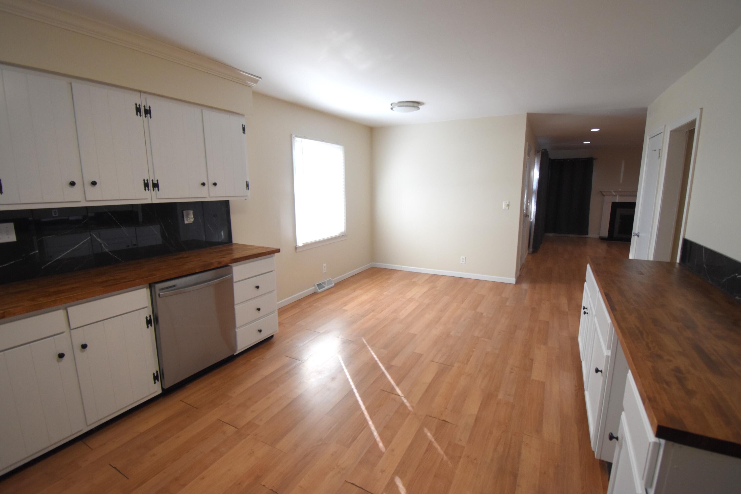 360 East Arnotts Drive Rensselaer, IN 47978 - Photo 20 of 39 a view of a kitchen with wooden floor and cabinets