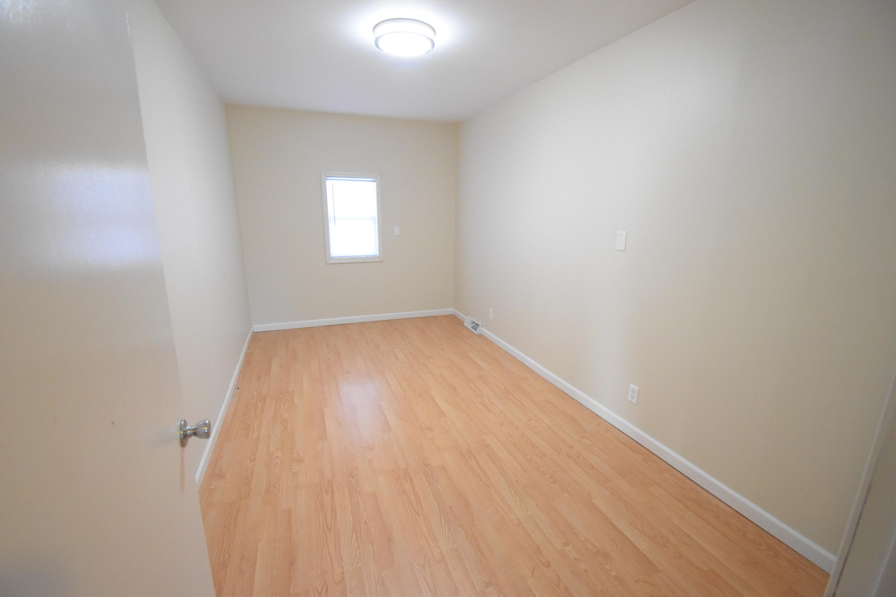 360 East Arnotts Drive Rensselaer, IN 47978 - Photo 21 of 39 an empty room with a window