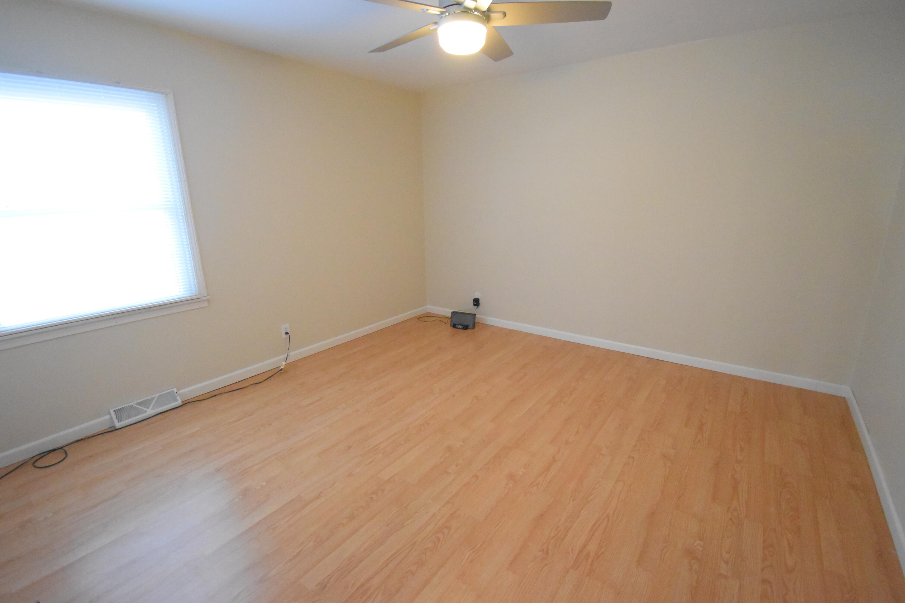 360 East Arnotts Drive Rensselaer, IN 47978 - Photo 24 of 39 an empty room with a window and a fan
