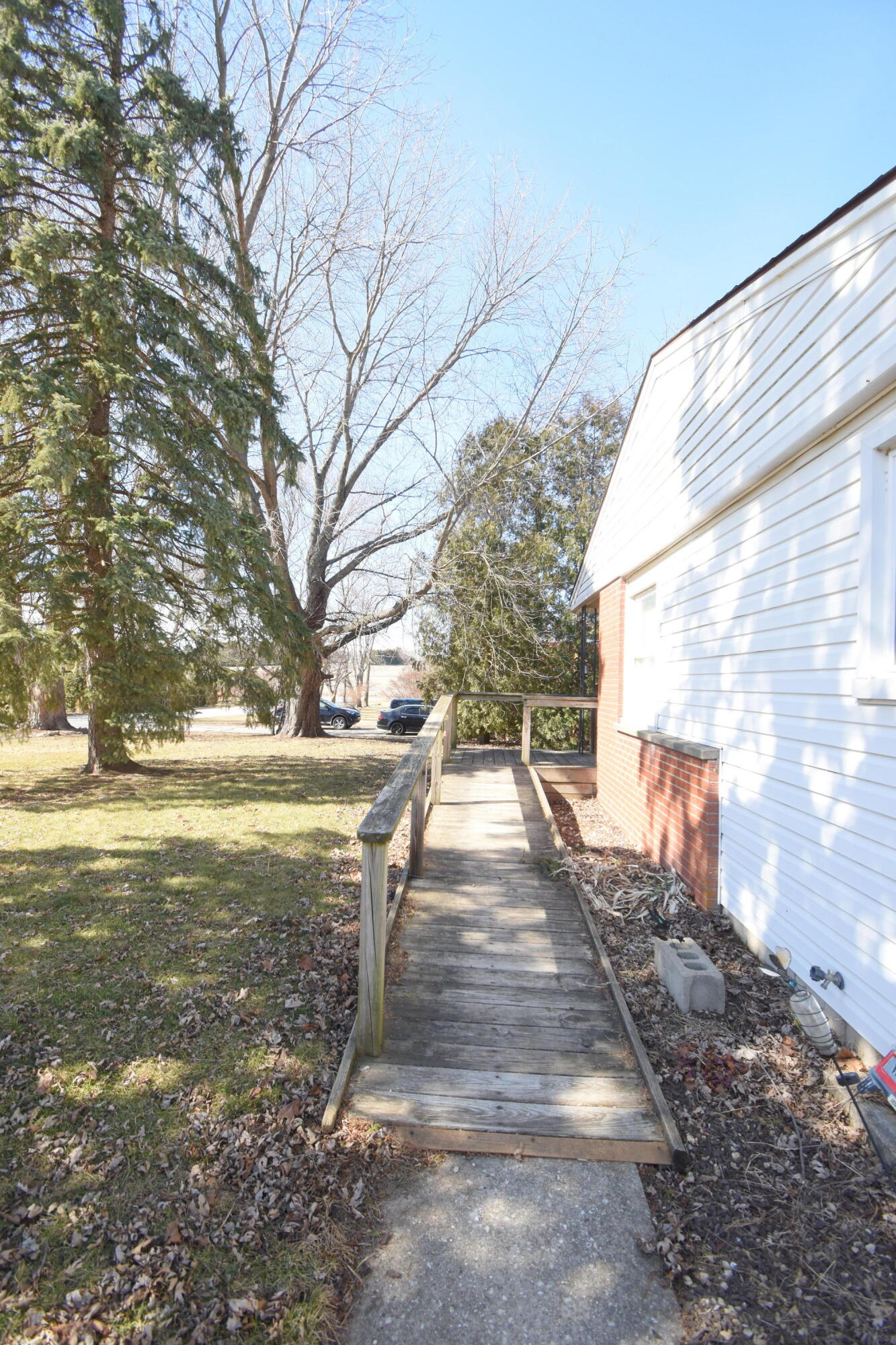 360 East Arnotts Drive Rensselaer, IN 47978 - Photo 7 of 39 a view of a yard with a tree
