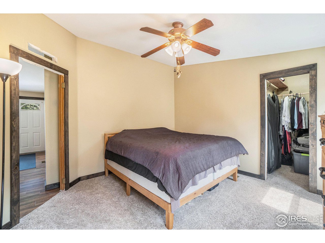 50 Pine Drive Lyons, CO 80540 - Photo 15 of 39 a bedroom with a bed and a chandelier