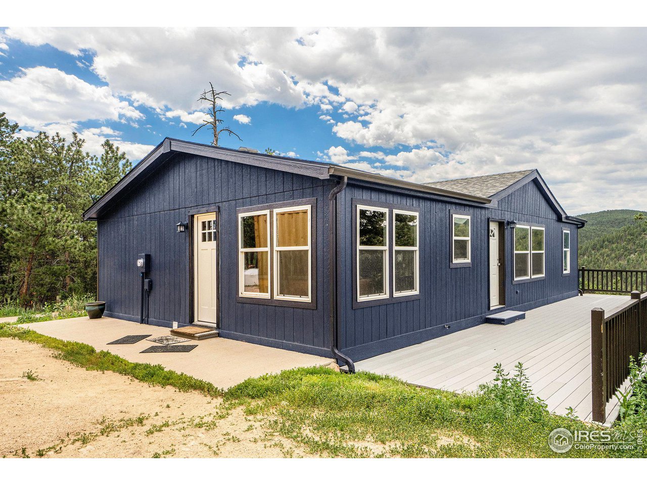 50 Pine Drive Lyons, CO 80540 - Photo 21 of 39 a front view of a house with a yard