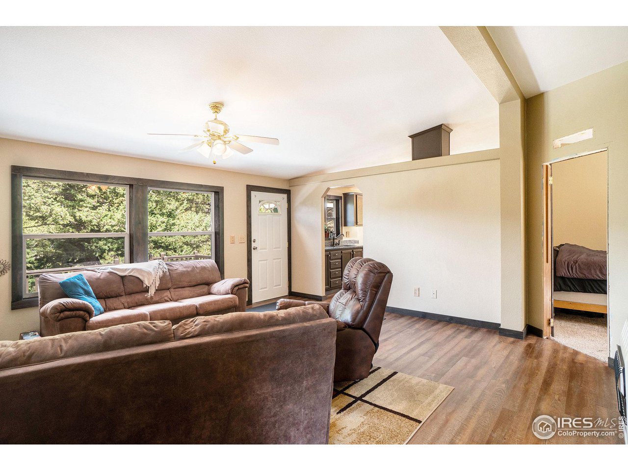 50 Pine Drive Lyons, CO 80540 - Photo 5 of 39 a living room with furniture and a large window