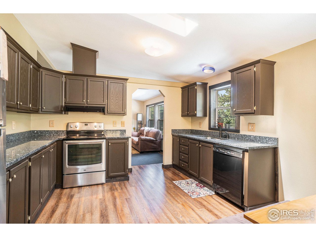 50 Pine Drive Lyons, CO 80540 - Photo 7 of 39 a kitchen with stainless steel appliances granite countertop a stove a sink dishwasher and a refrigerator