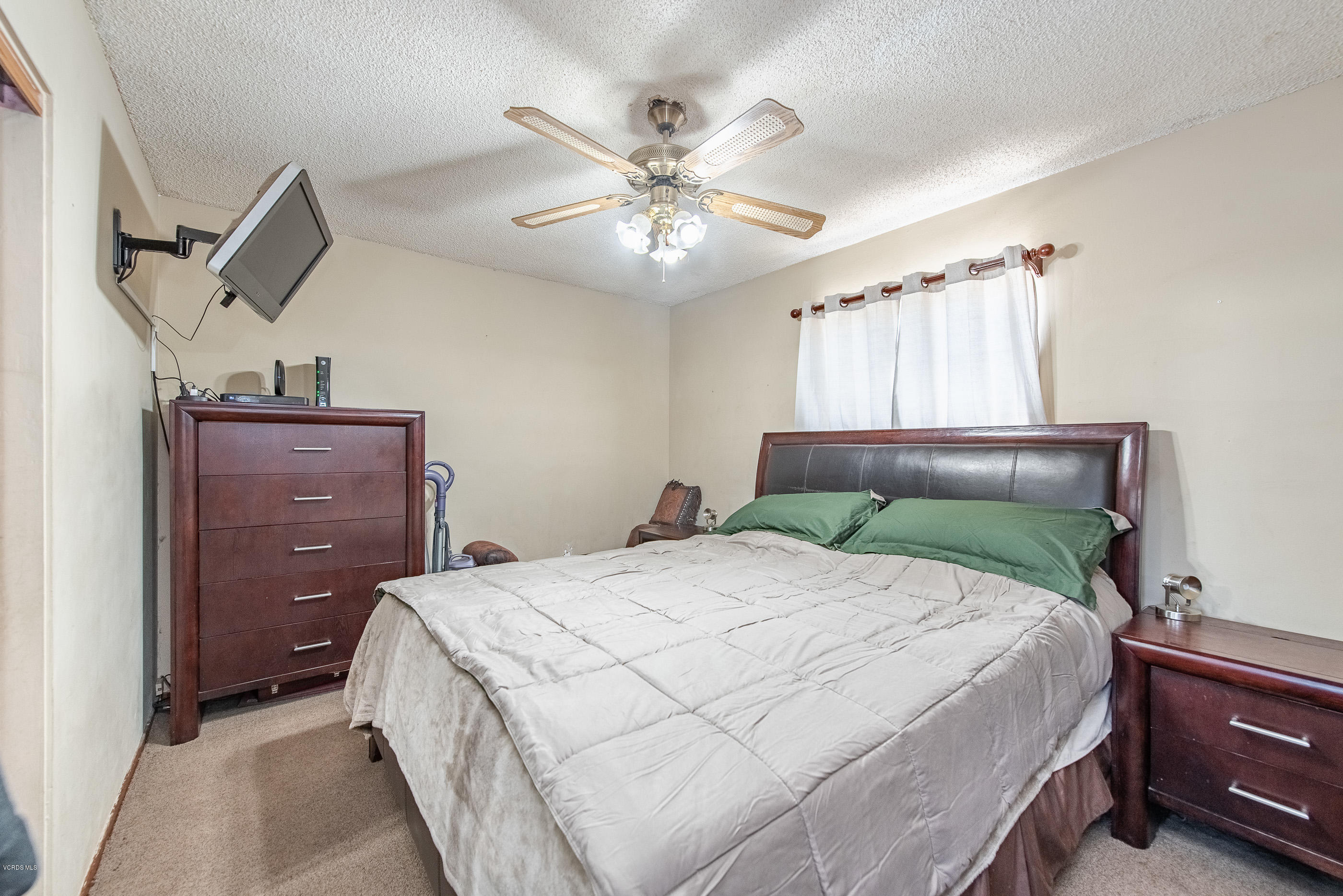 6292 Hope Street Simi Valley, CA 93063 - Photo 12 of 20 a bedroom with a bed and ceiling fan