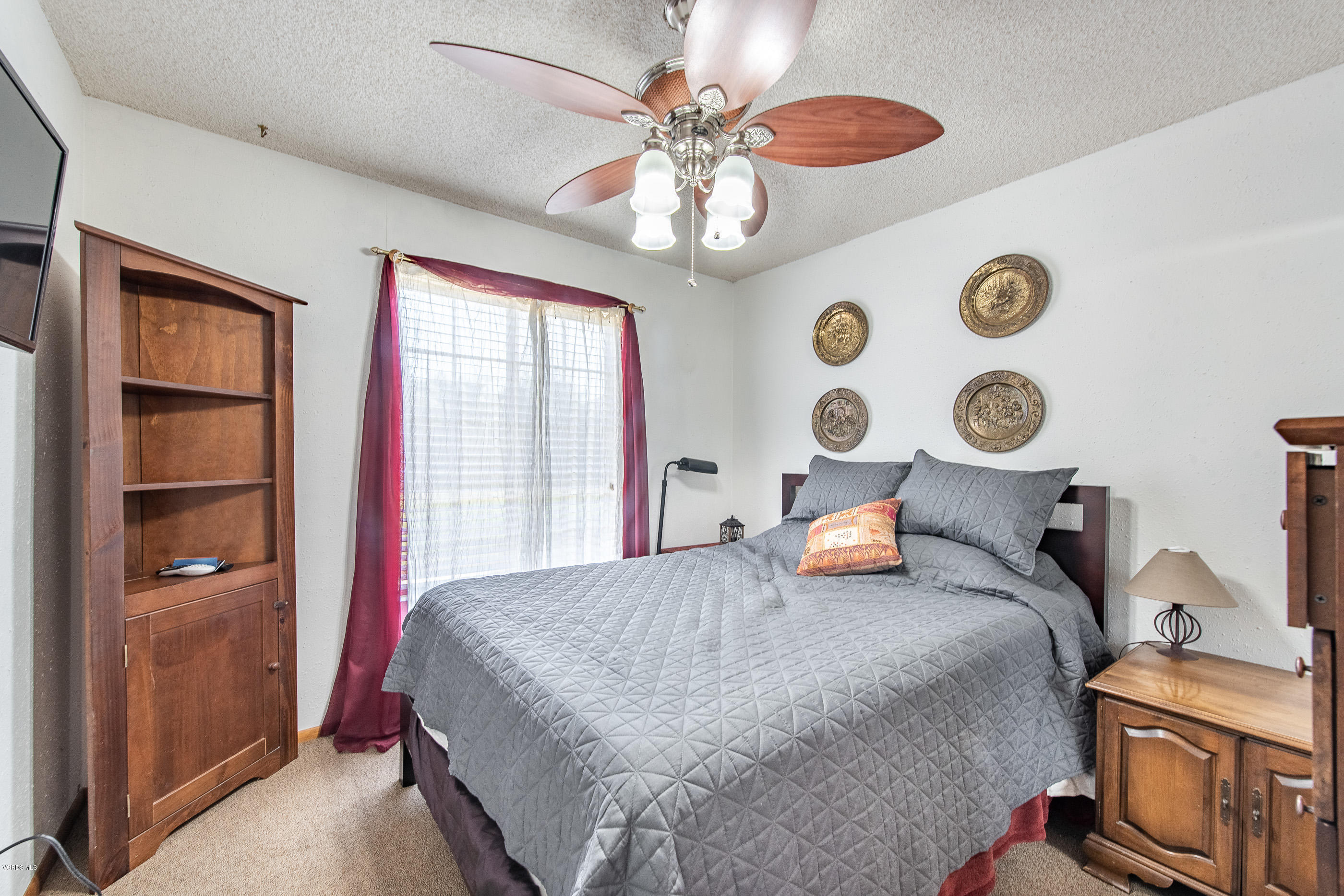 6292 Hope Street Simi Valley, CA 93063 - Photo 13 of 20 a bedroom with a bed and a chandelier