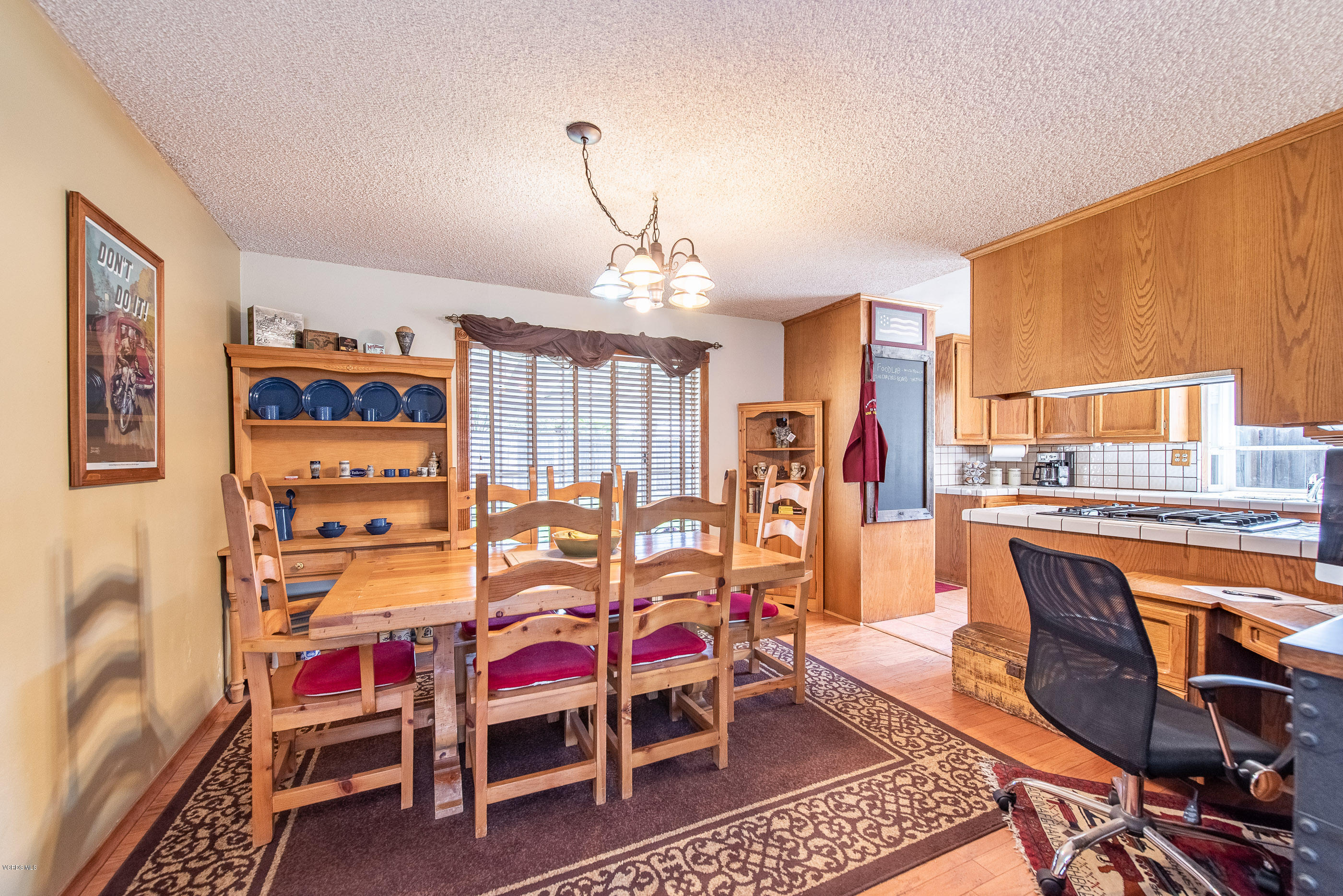 6292 Hope Street Simi Valley, CA 93063 - Photo 7 of 20 a dining room with furniture and wooden floor