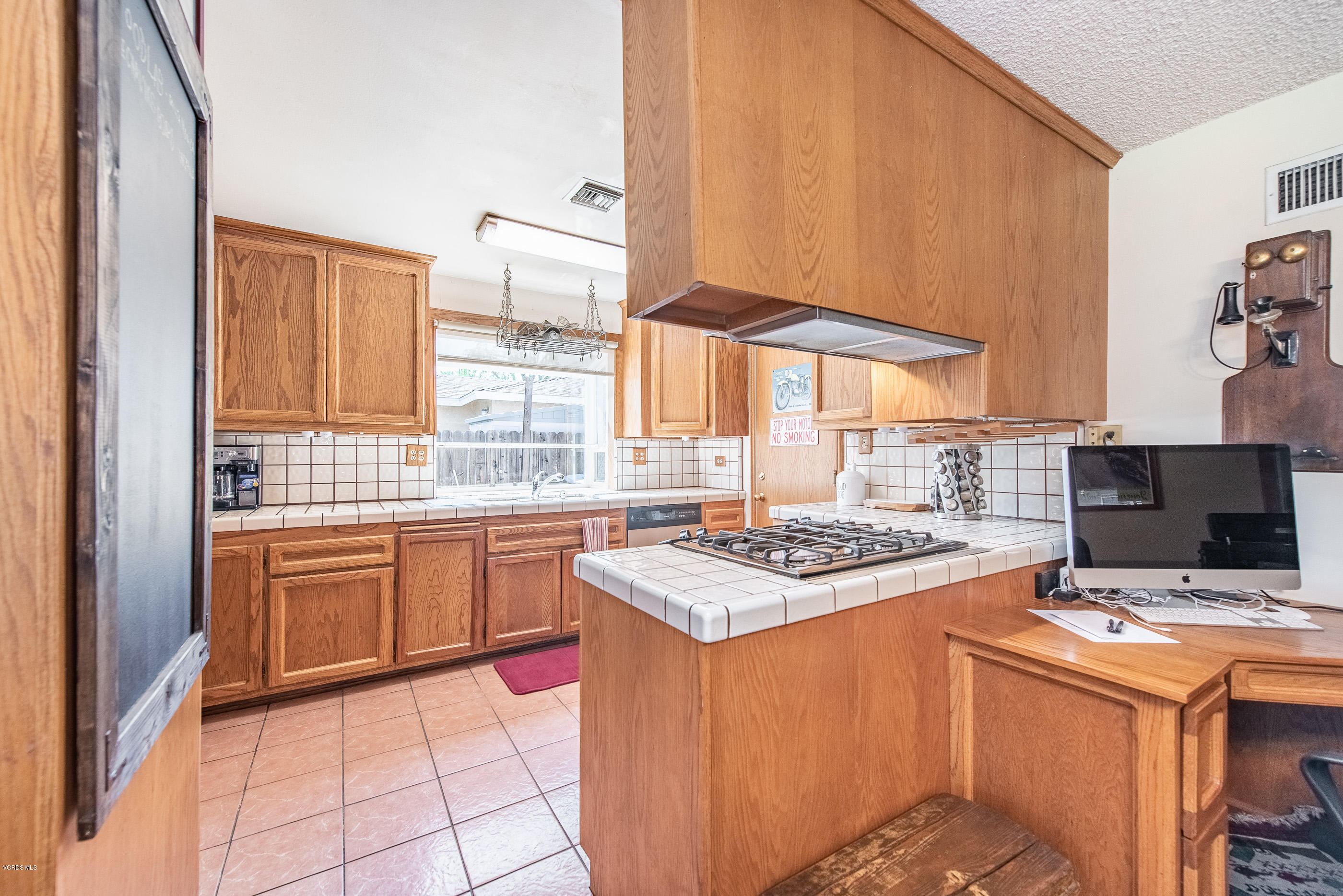 6292 Hope Street Simi Valley, CA 93063 - Photo 8 of 20 a kitchen with stainless steel appliances a stove a sink and a refrigerator