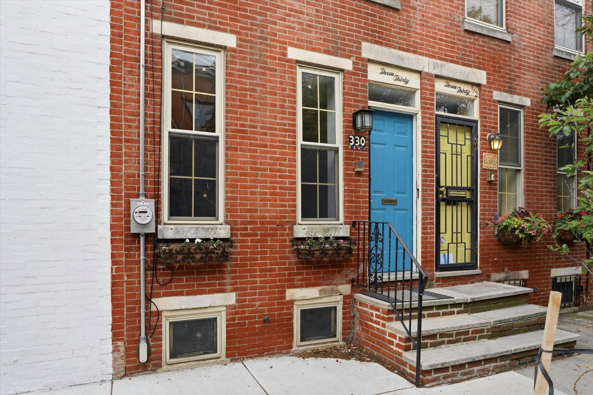 330 Monroe Street Philadelphia, PA 19147 - Photo 2 of 33 Original brick facade w/ flower boxes & blue door.