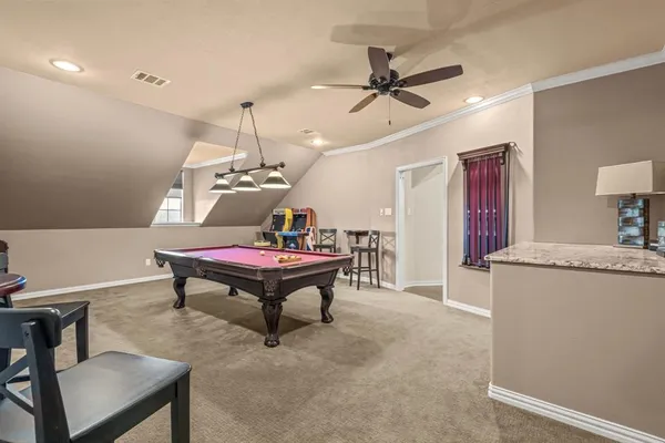 a living room with furniture a rug and a chandelier