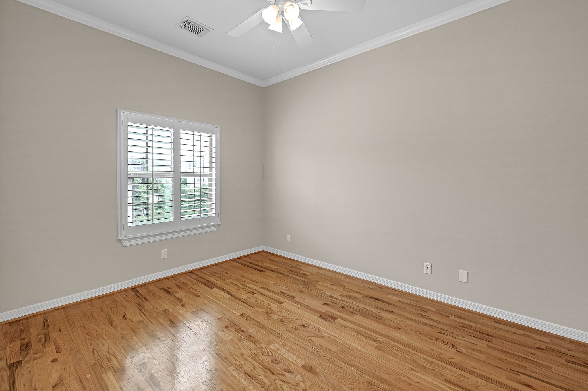 1204 Cohn Street Houston, TX 77007 - Photo 24 of 25 wooden floor in an empty room with a window