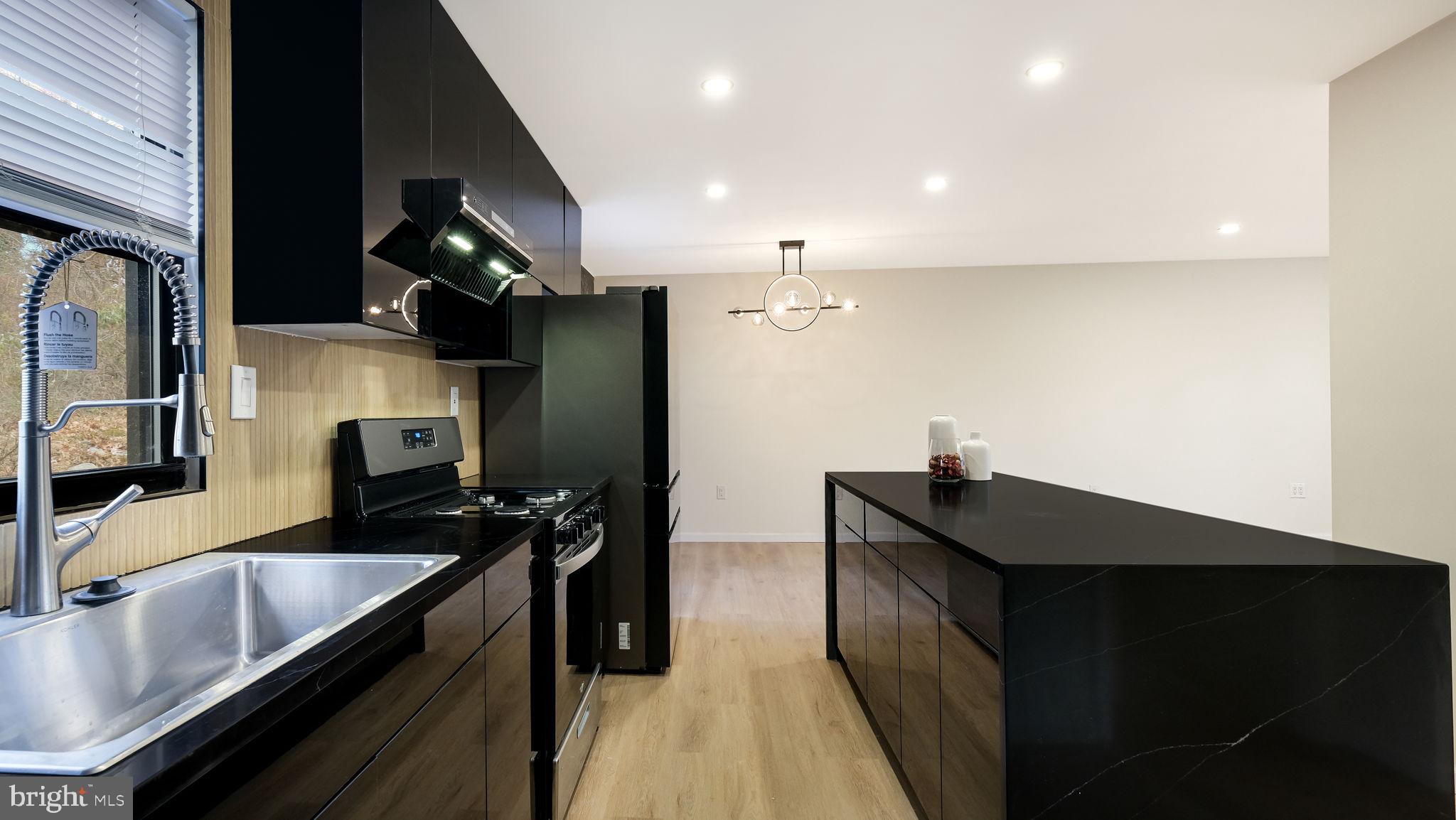 1617 Church Road Wyncote, PA 19095 - Photo 13 of 39 Sleek modern kitchen with elegant finishes.
