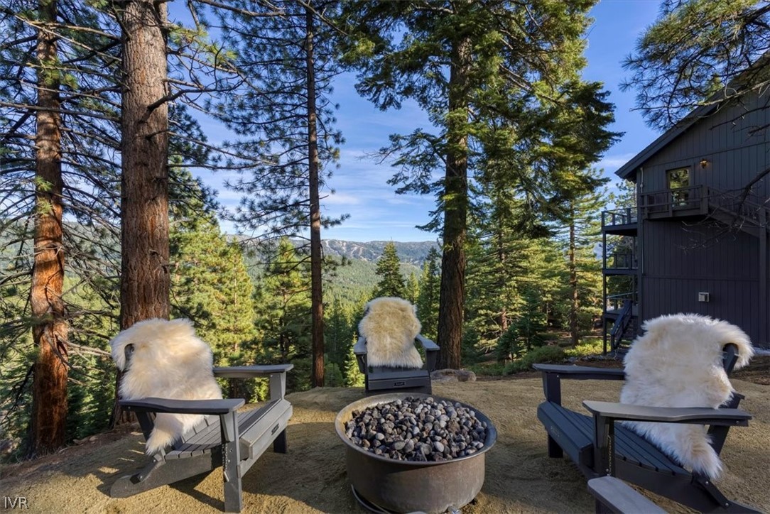 877 Tyner Way Incline Village, NV 89451 - Photo 34 of 43 a view of a chairs and table in backyard