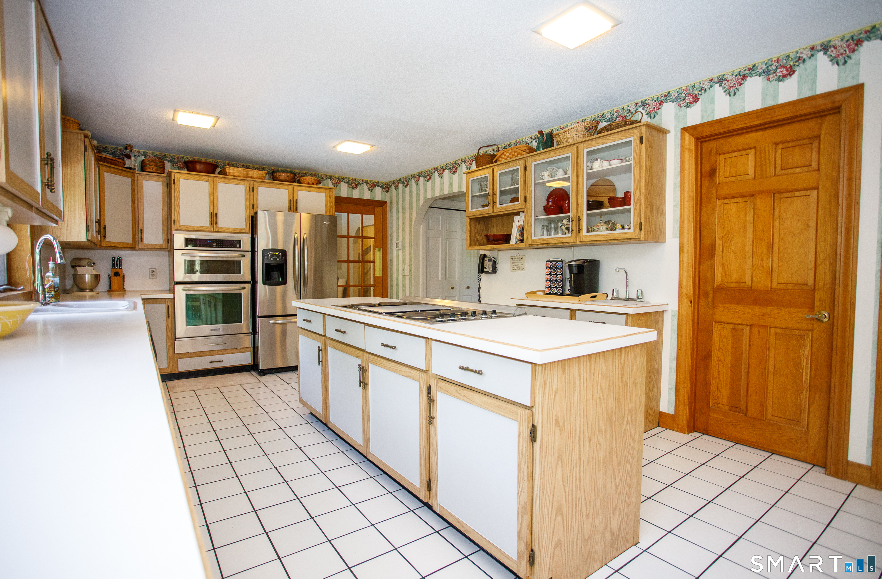 25 Stony Ridge Road Norwich, CT 06360 - Photo 10 of 40 a kitchen with stainless steel appliances granite countertop a stove and a refrigerator