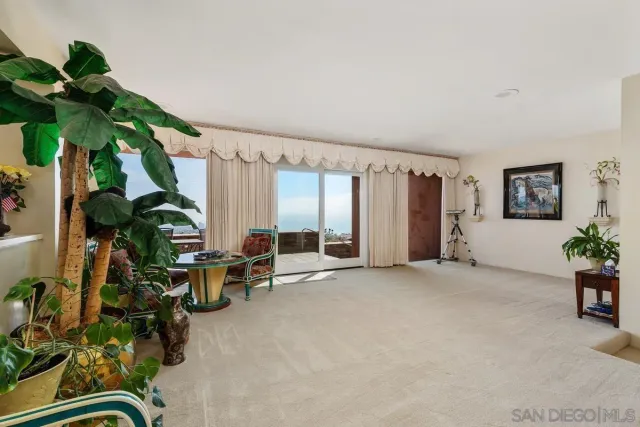 a view of balcony with furniture