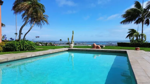 a view of a swimming pool and a yard