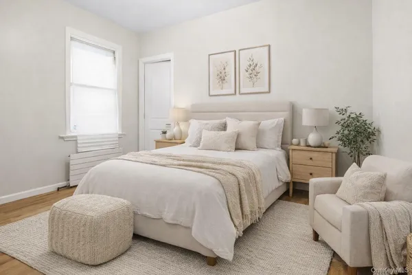 a bedroom with bed and a couch