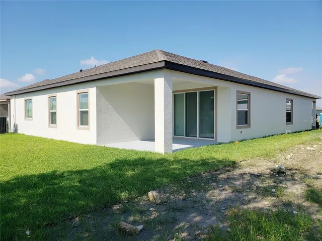a view of a house with backyard