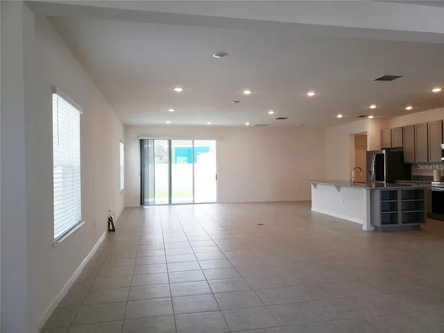 a view of empty room with windows