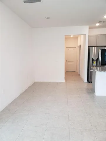 an empty room with a empty space and a window