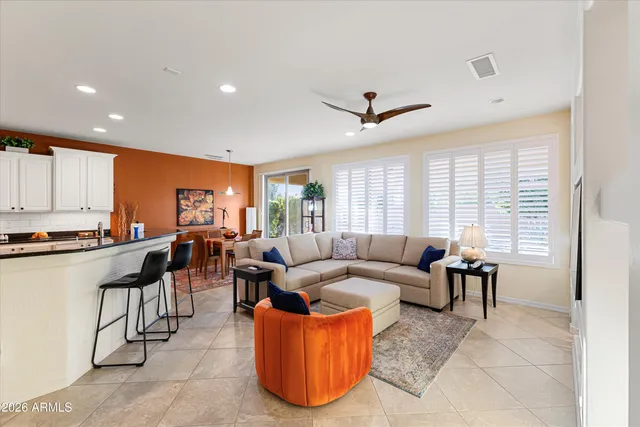 a front view of a house with outdoor seating