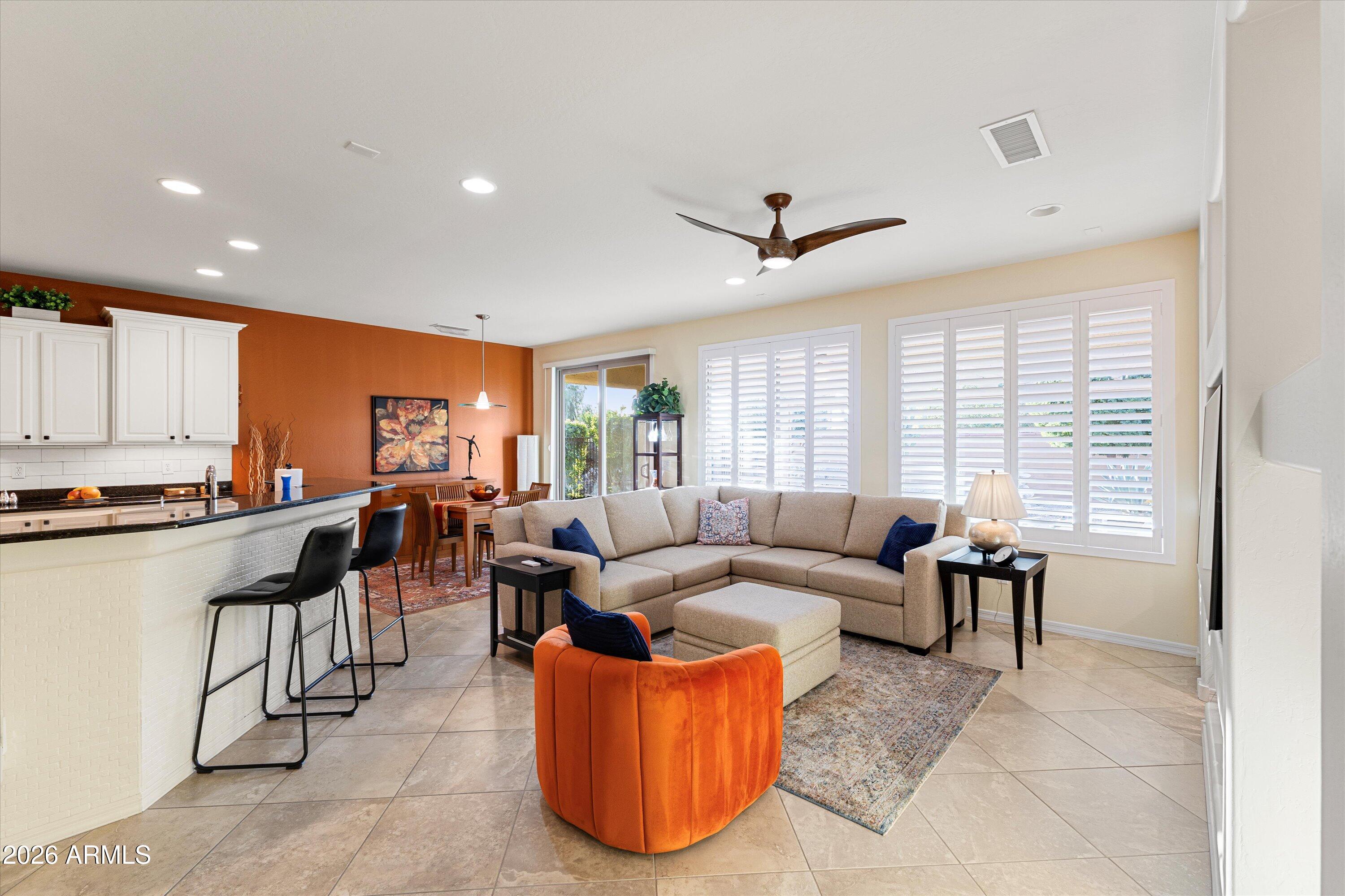20652 North 267th Avenue Buckeye, AZ 85396 - Photo 11 of 53 a living room with furniture and a large window