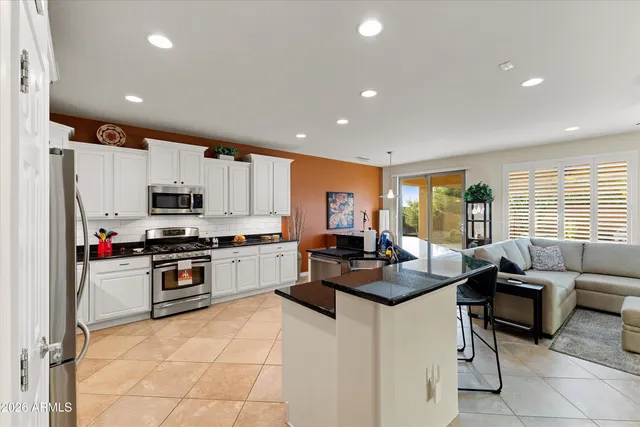 a living room with fireplace furniture and a flat screen tv