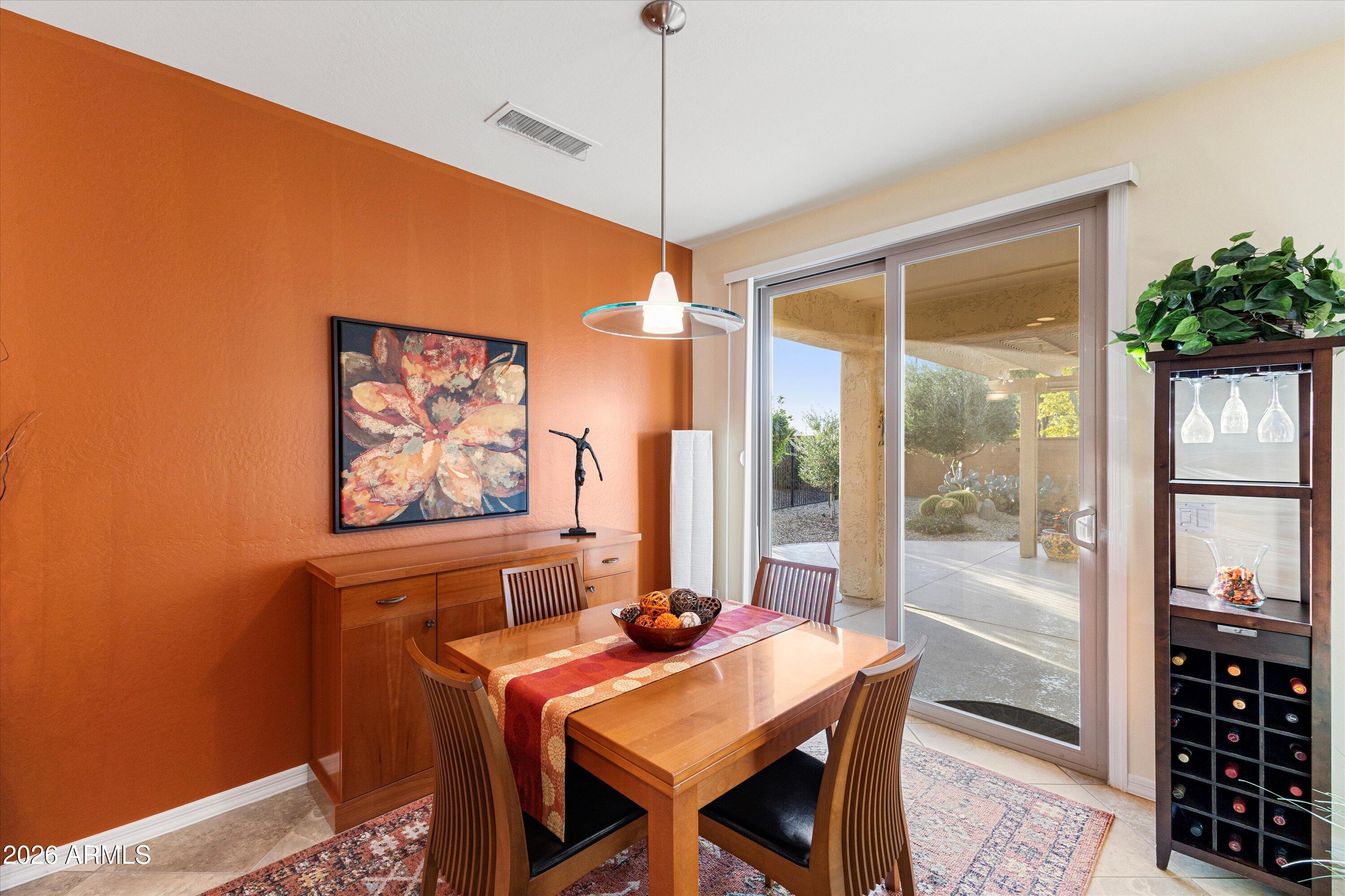 20652 North 267th Avenue Buckeye, AZ 85396 - Photo 22 of 53 a dining room with furniture and window