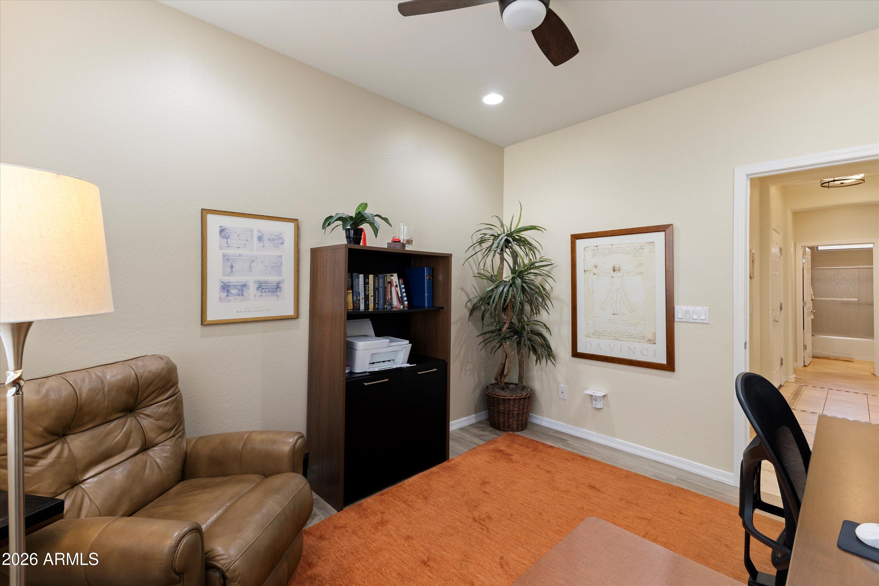 20652 North 267th Avenue Buckeye, AZ 85396 - Photo 31 of 53 a living room with furniture and a flat screen tv