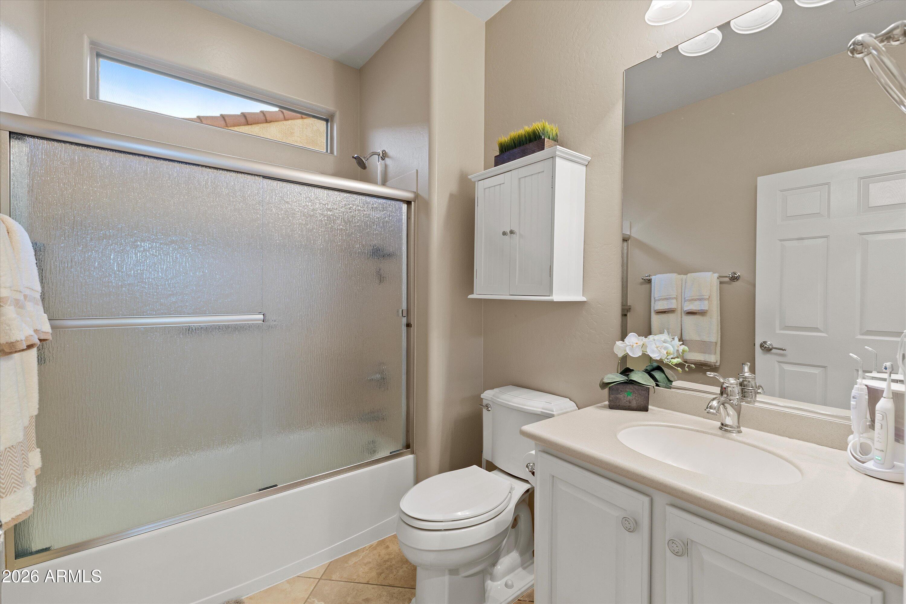 20652 North 267th Avenue Buckeye, AZ 85396 - Photo 32 of 53 a bathroom with a sink toilet and shower