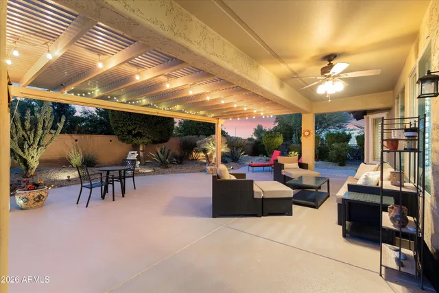 a view of a tables and chairs in patio