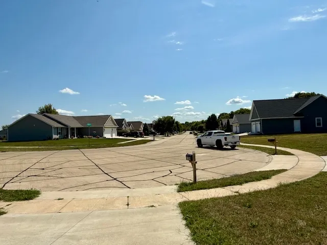 a view of a lake with a house in background