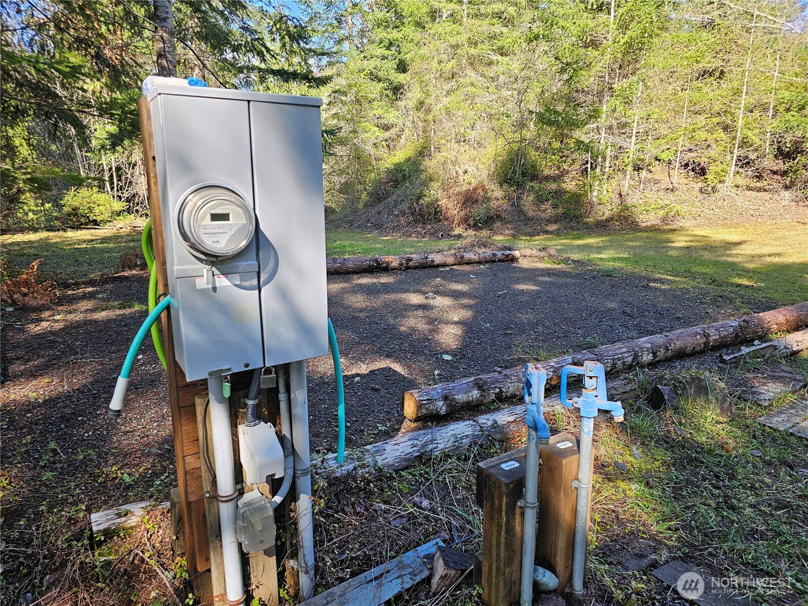 753 Jupiter Loop Brinnon, WA 98320 - Photo 12 of 25 a table and chairs sitting next to a yard