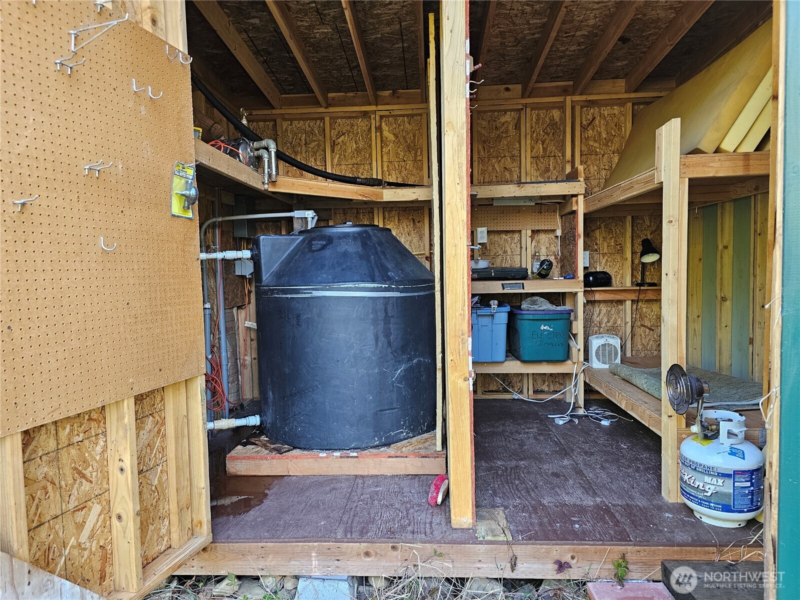 753 Jupiter Loop Brinnon, WA 98320 - Photo 22 of 25 a kitchen with a refrigerator and chairs