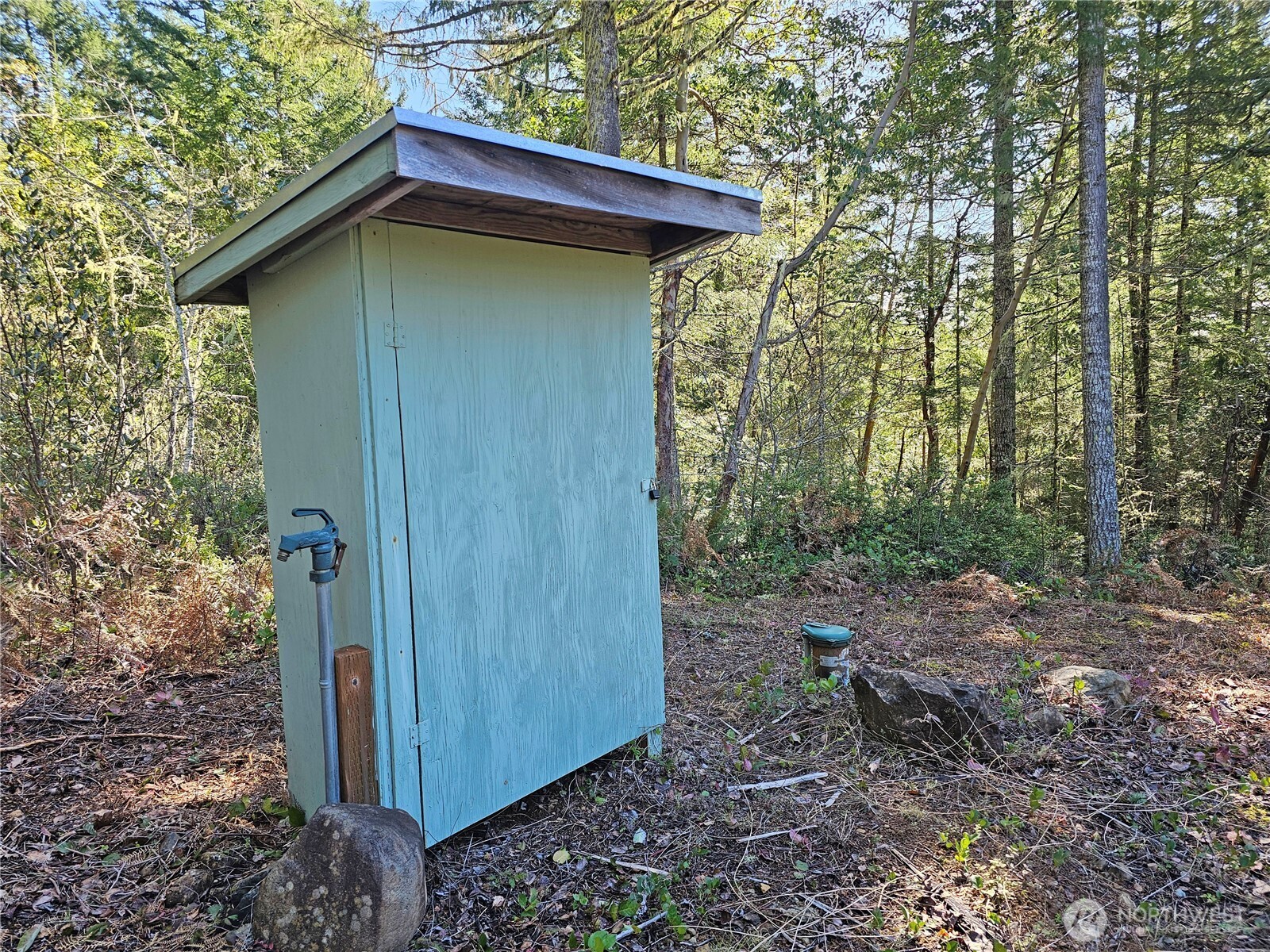 753 Jupiter Loop Brinnon, WA 98320 - Photo 8 of 25 a view of a wooden house with a yard