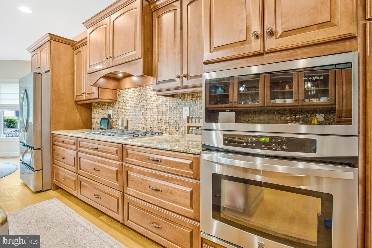 5 Jessie Road Harwood, MD 20776 - Photo 32 of 87 a kitchen with stainless steel appliances granite countertop a stove and a refrigerator