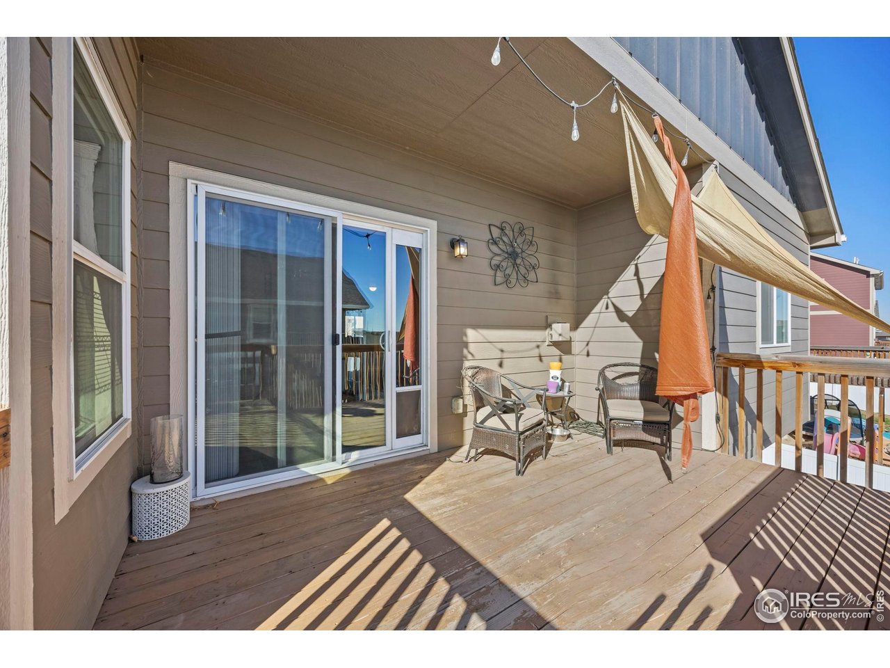 1344 87th Avenue Greeley, CO 80634 - Photo 24 of 31 a balcony with table and chairs