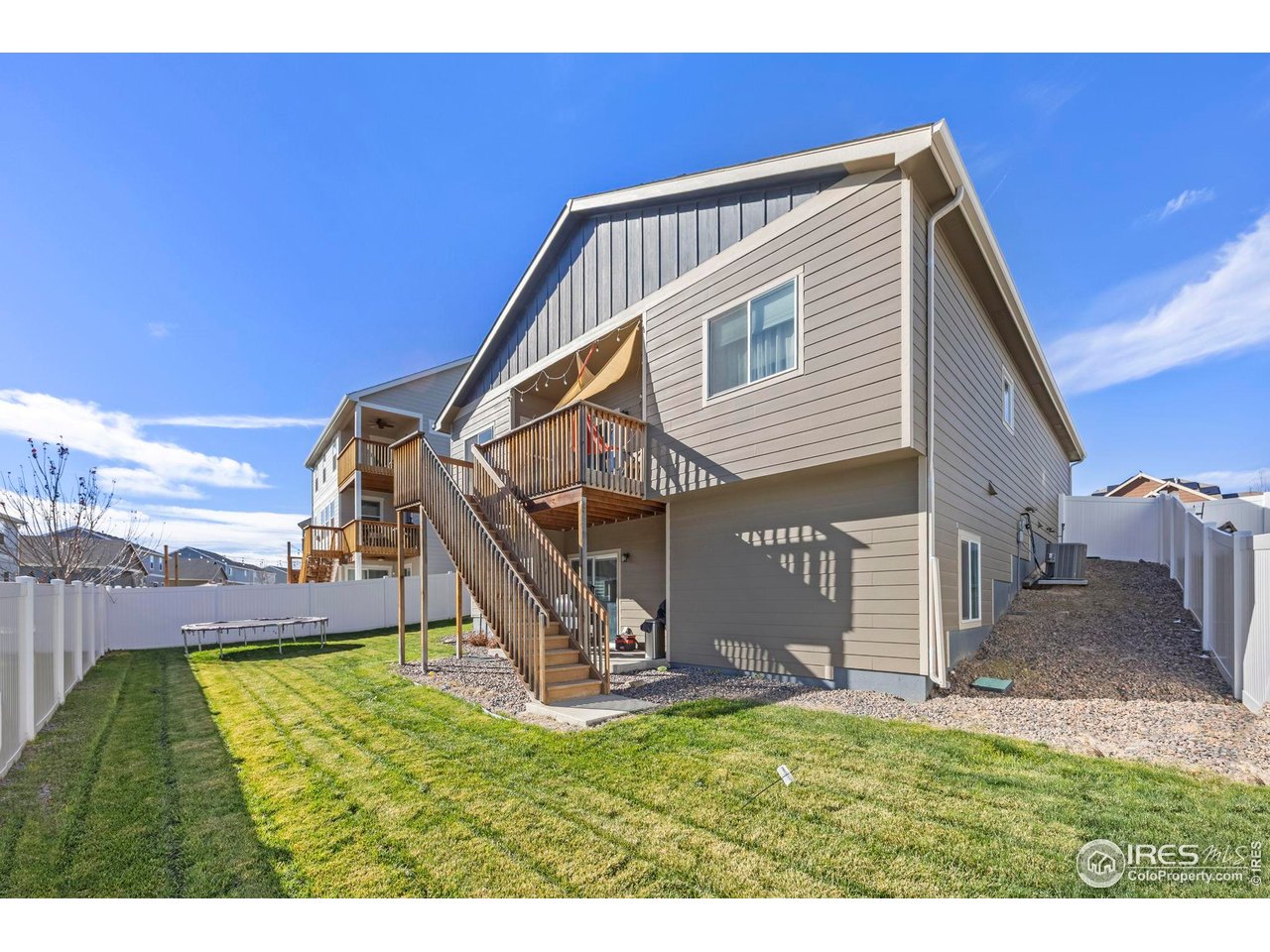 1344 87th Avenue Greeley, CO 80634 - Photo 27 of 31 a view of a house with a yard