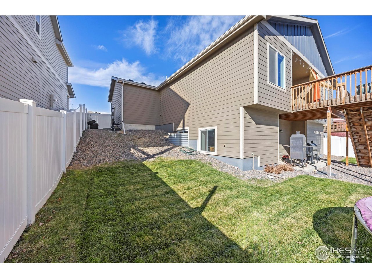 1344 87th Avenue Greeley, CO 80634 - Photo 29 of 31 a backyard of a house with table and chairs