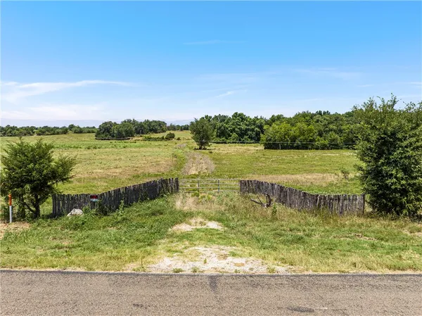 a view of a lake with a big yard
