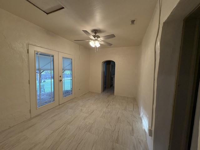 4876 East Williams Spring Road Fort Worth, TX 76135 - Photo 16 of 20 a view of a livingroom with a ceiling fan window and closet
