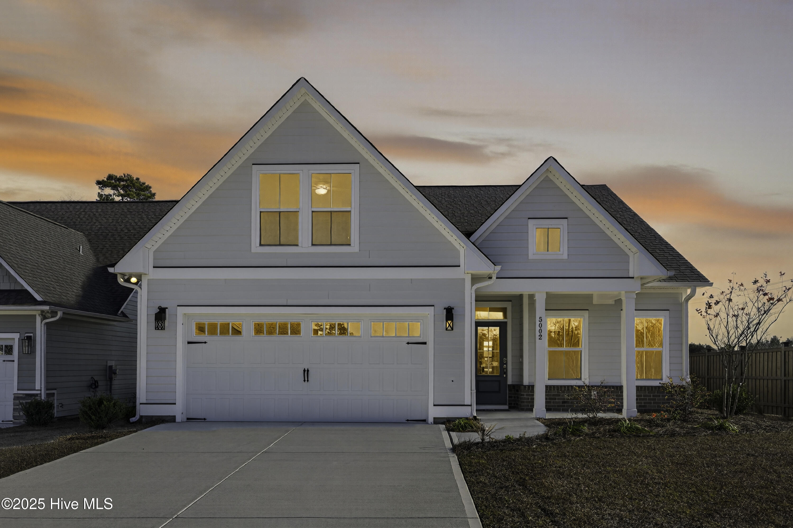 5002 Coastal Plain Point, Unit 67 Leland, NC 28451 - Photo 14 of 44 5002CoastalPlainFront_Dusk_01