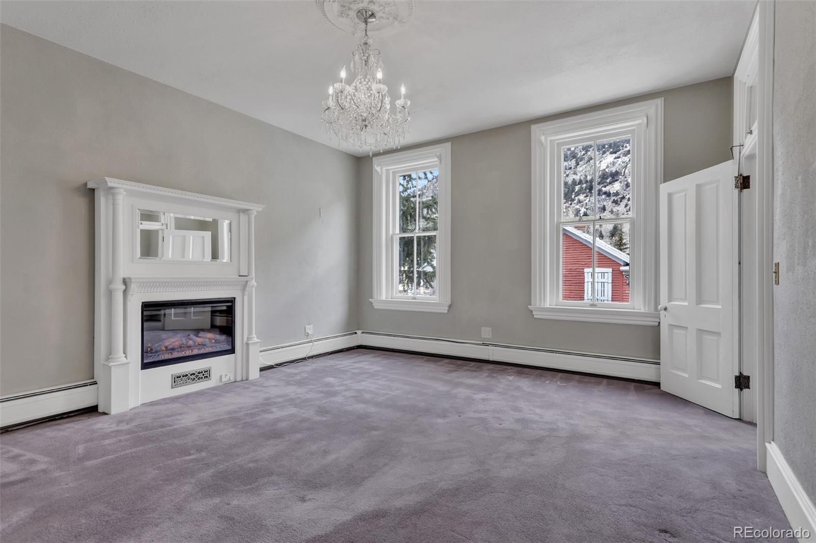 300 Rose Street Georgetown, CO 80444 - Photo 13 of 49 a view of livingroom with furniture fireplace and window