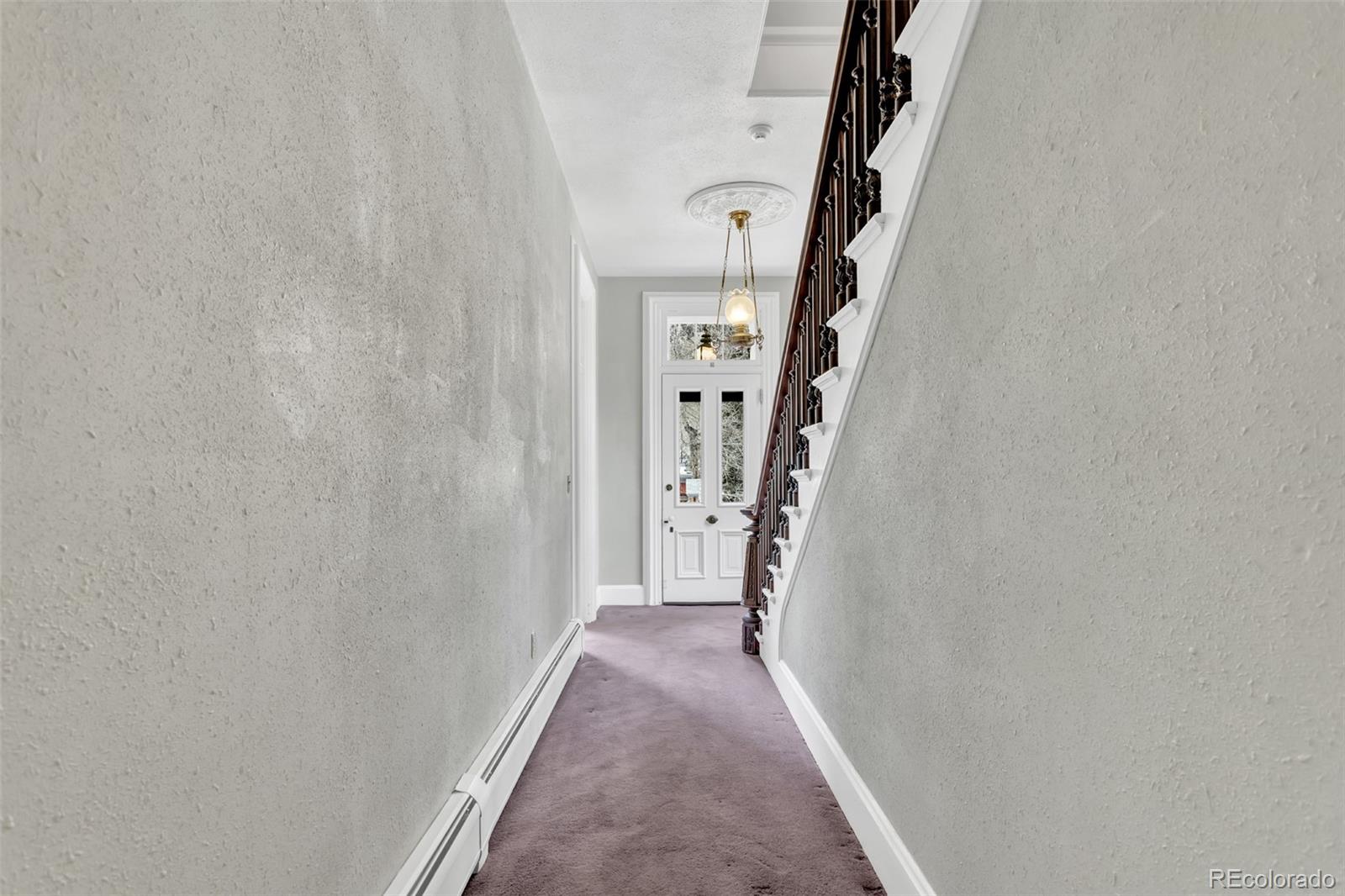 300 Rose Street Georgetown, CO 80444 - Photo 21 of 49 a view of a hallway with wooden floor and entryway