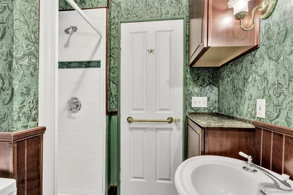 a bathroom with a sink and mirror