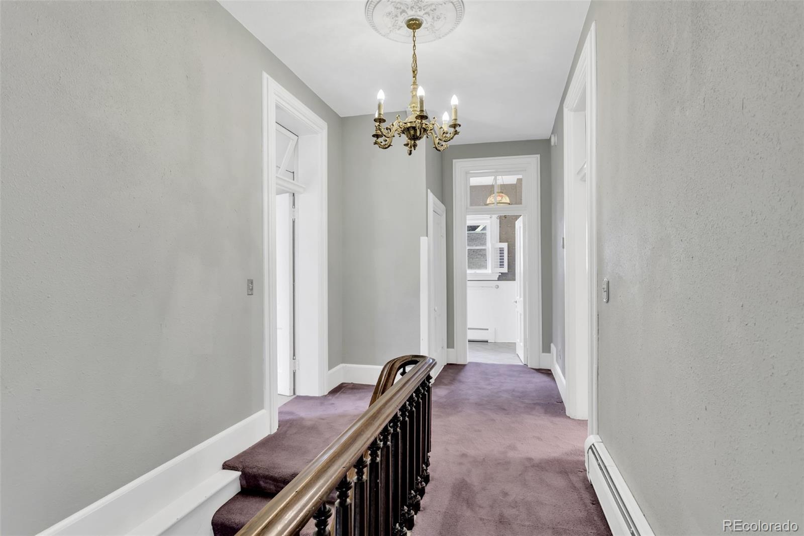 300 Rose Street Georgetown, CO 80444 - Photo 26 of 49 a view of a hallway with chandelier