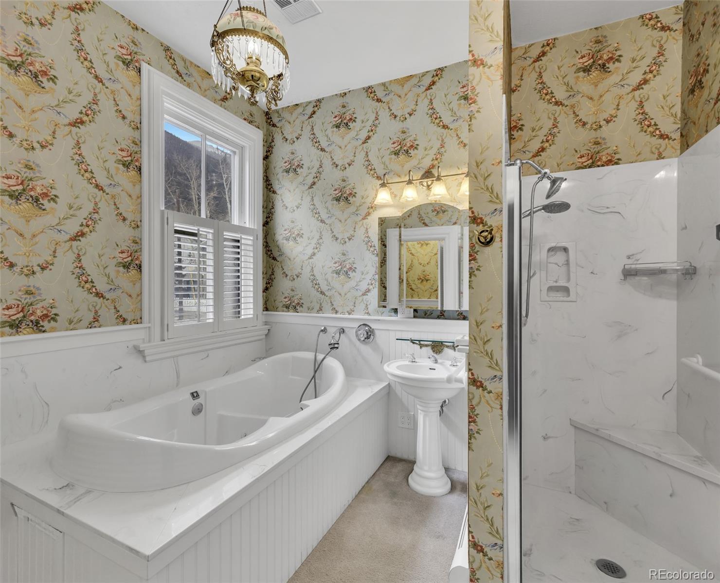 300 Rose Street Georgetown, CO 80444 - Photo 30 of 49 a bathroom with a bathtub and shower