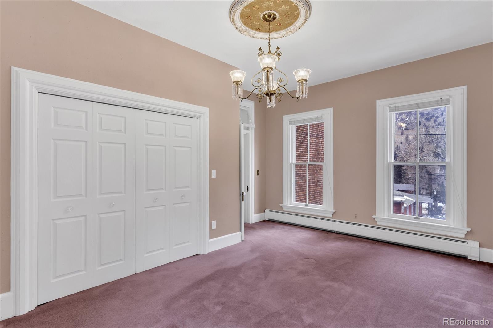 300 Rose Street Georgetown, CO 80444 - Photo 34 of 49 en empty room with windows and fan