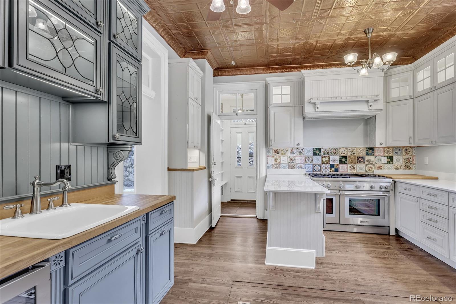 300 Rose Street Georgetown, CO 80444 - Photo 5 of 49 a kitchen with stainless steel appliances granite countertop a sink stove and refrigerator