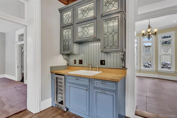 a bathroom with a granite countertop sink and a shower